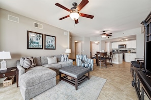Open concept living, dining and kitchen area.