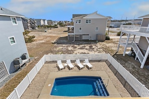This stunning 4-bedroom, 2.5-bathroom home offers everything you need for a relaxing beach vacation, complete with a Private Pool, hot tub, and beach access across the street.