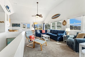 The reverse floor plan on the Top Level features an open-concept Living Area, Dining Area, and a fully equipped Kitchen, making it easy to gather, cook, and share meals with your loved ones.