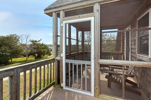 Soak up those fresh ocean breezes on the screened-in porch.