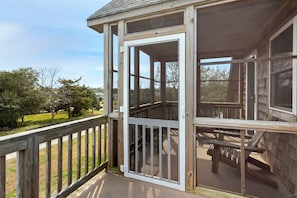 Soak up those fresh ocean breezes on the screened-in porch.