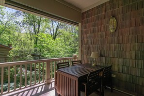 Enjoy your morning coffee on the covered front porch while listening to the tranquil sounds of nature