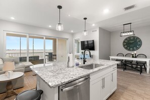 Experience the beauty of open floor living—where the kitchen, dining, and living spaces flow seamlessly together.