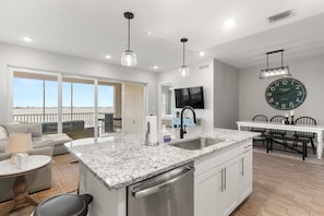 Experience the beauty of open floor living—where the kitchen, dining, and living spaces flow seamlessly together.
