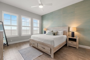 Wake up to stunning views—our bedroom features expansive windows that let nature in.