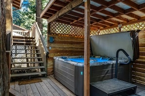 Soak in serenity with a private hot tub, offering total privacy.