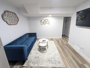Living area with comfy counch and modern coffee table
