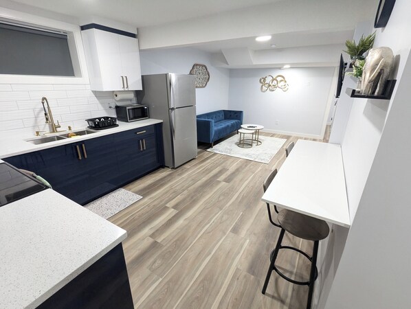 View of the kitchen & living room as soon as guests enter