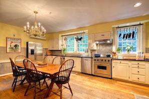 The kitchen is fully equipped with high-quality cookware, utensils, and all the essentials for preparing meals with ease — highlighted by a professional-grade Viking stove for the culinary enthusiast.