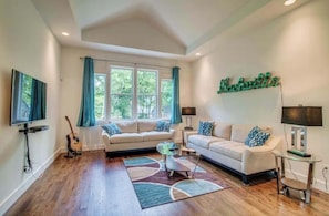 Living Room: 🎉 The perfect spot to gather, laugh, and lounge in style.