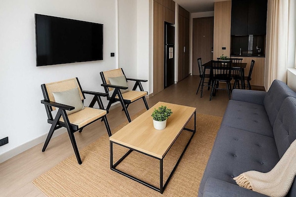 Experience modern comfort in this stylish living space, featuring a cozy seating area and a sleek kitchen for your perfect getaway.