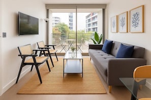 Bright and modern living space with large windows, stylish decor, and a cozy atmosphere. Perfect for relaxation and enjoying the view!