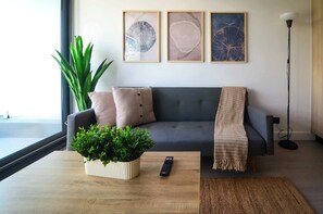 Relax in this cozy living room, featuring stylish decor and a welcoming atmosphere perfect for unwinding after a day of adventure.