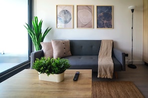 Relax in this cozy living room, featuring stylish decor and a welcoming atmosphere perfect for unwinding after a day of adventure.