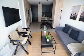 Experience modern comfort in this stylish living space, featuring an open layout and chic decor, perfect for relaxation and gatherings.