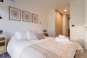 Relax in this cozy bedroom featuring soft tones, stylish decor, and all the comforts you need for a restful getaway.