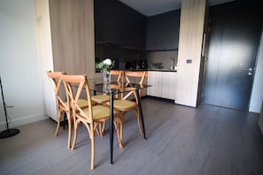 Enjoy a cozy dining space with a modern kitchen, perfect for preparing meals and making memories during your stay.