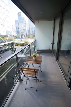 Enjoy a cozy balcony with city views, perfect for morning coffee or evening relaxation.