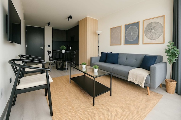 Experience modern comfort in this stylish living room, featuring chic decor and an inviting atmosphere perfect for relaxation.