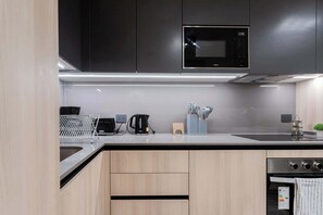 Sleek, modern kitchen with top-notch appliances and ample counter space for your culinary adventures.