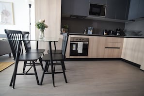 Enjoy a sleek and modern kitchen with stylish dining space, perfect for meals and gatherings during your stay.