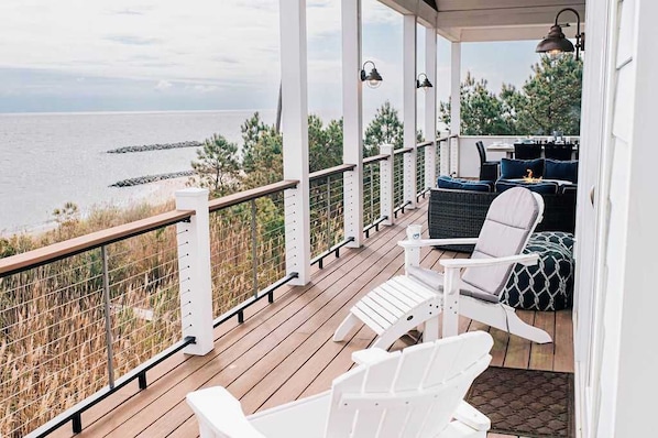 Spanning the length of the house, the waterfront deck is designed for long, slow mornings and unforgettable sunset views.