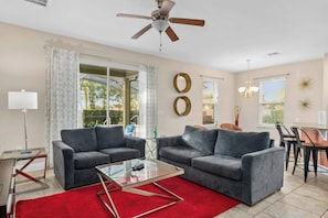 Love the comfortable sofas and bright atmosphere? This living room at Storey Lake Resort is perfect for unwinding after a day at the parks