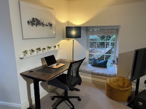 Height-adjustable desk and desk chair.