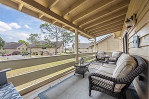 Lounge the day away in the fresh air on the breezy balcony