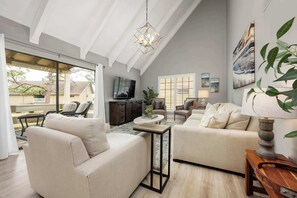 Curl up in the serene living room & enjoy a movie night at home