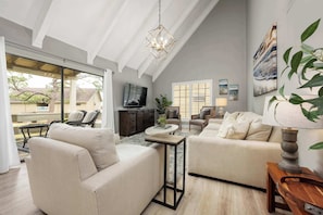 Curl up in the serene living room & enjoy a movie night at home