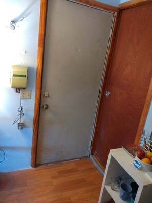 Door to the outside and door to bathroom from kitchenette.