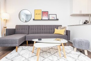 Each living room has a stylish sectional with 55" smart TV