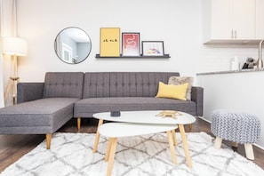 Each living room has a stylish sectional with 55" smart TV