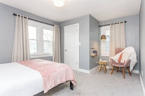 Spacious primary bedroom offers a cozy reading nook, full ensuite bathroom and large closet.