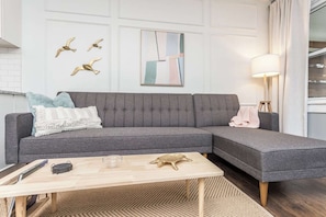 Comfortable sectional seating in the main living area also provides an extra sleeping space if needed.