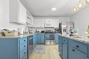 Spacious, fully stocked kitchen 