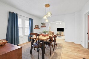 Dining area seats 6 flows seamlessly into the adjacent living room.