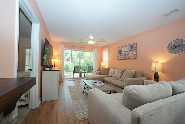 Spacious Living Space with Screened-In Porch Access