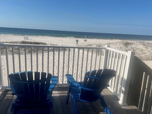 Shared Balcony at beach end of buildings.  Look for the 2 blue chairs. 