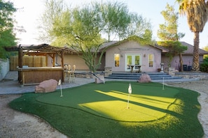 House #2 backyard with putting green and bar