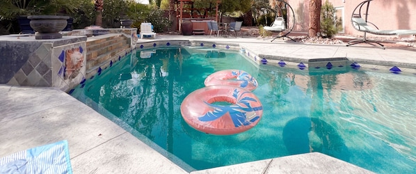 House #1 backyard with pool, spa, outdoor lounge, dining, and BBQ