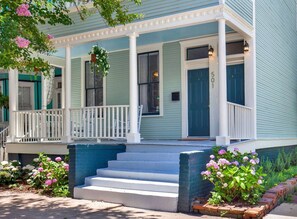 Admire the timeless blue exterior, showcasing the classic beauty of this Victorian home.