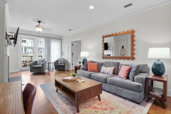 Cozy up in the stylish living room, where natural light pours in.