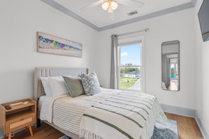 Unwind in the spacious primary suite, complete with a king bed, smart TV, and calming ambiance—your private retreat