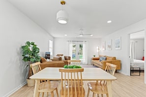 The open dining area flows seamlessly into the living room, making it easy to share meals, laughter, and lazy mornings all in one inviting space.