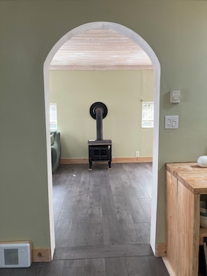 Wood stove viewed through the archway