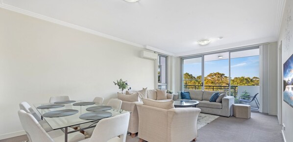 This spacious apartment features bright, open concept living with beautiful, leafy views