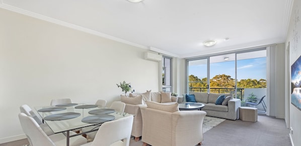 This spacious apartment features bright, open concept living with beautiful, leafy views