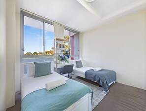 Bedroom two is perfect for families or travelling professionals with two single beds and a workspace
